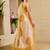 Beige shimmer printed zari saree with unstitched blouse piece.