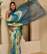 Teal shimmer printed zari saree with unstitched blouse piece.