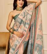 Peach & sea green shimmer printed zari saree with unstitched blouse piece.