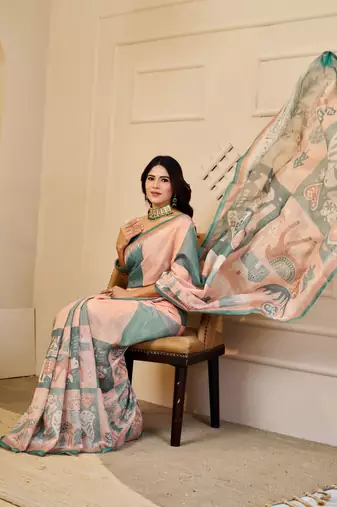 Peach & sea green shimmer printed zari saree with unstitched blouse piece.