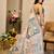 Peach & sea green shimmer printed zari saree with unstitched blouse piece.