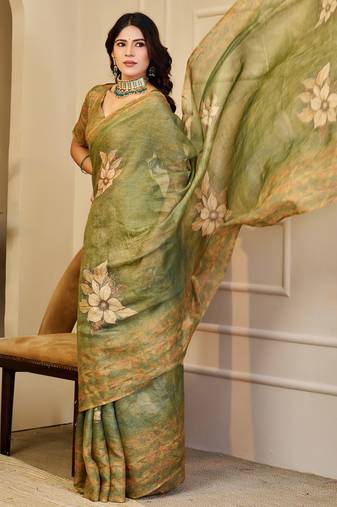 Olive shimmer printed zari saree with unstitched blouse piece.