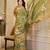 Olive shimmer printed zari saree with unstitched blouse piece.