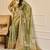 Olive shimmer printed zari saree with unstitched blouse piece.
