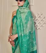 Turquoise shimmer printed zari saree with unstitched blouse piece.