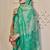 Turquoise shimmer printed zari saree with unstitched blouse piece.