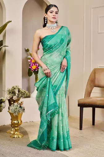 Turquoise shimmer printed zari saree with unstitched blouse piece.