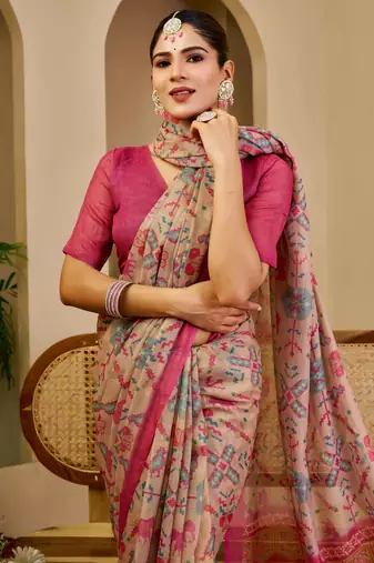 Beige shimmer printed zari saree with unstitched blouse piece.