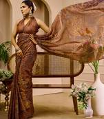 Brown shimmer printed zari saree with unstitched blouse piece.