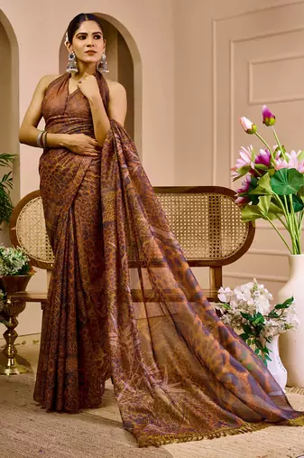 Brown shimmer printed zari saree with unstitched blouse piece.