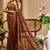 Brown shimmer printed zari saree with unstitched blouse piece.