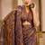 Brown shimmer printed zari saree with unstitched blouse piece.