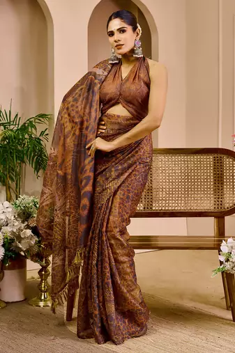 Brown shimmer printed zari saree with unstitched blouse piece.