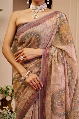 Mauve shimmer printed zari saree with unstitched blouse piece.