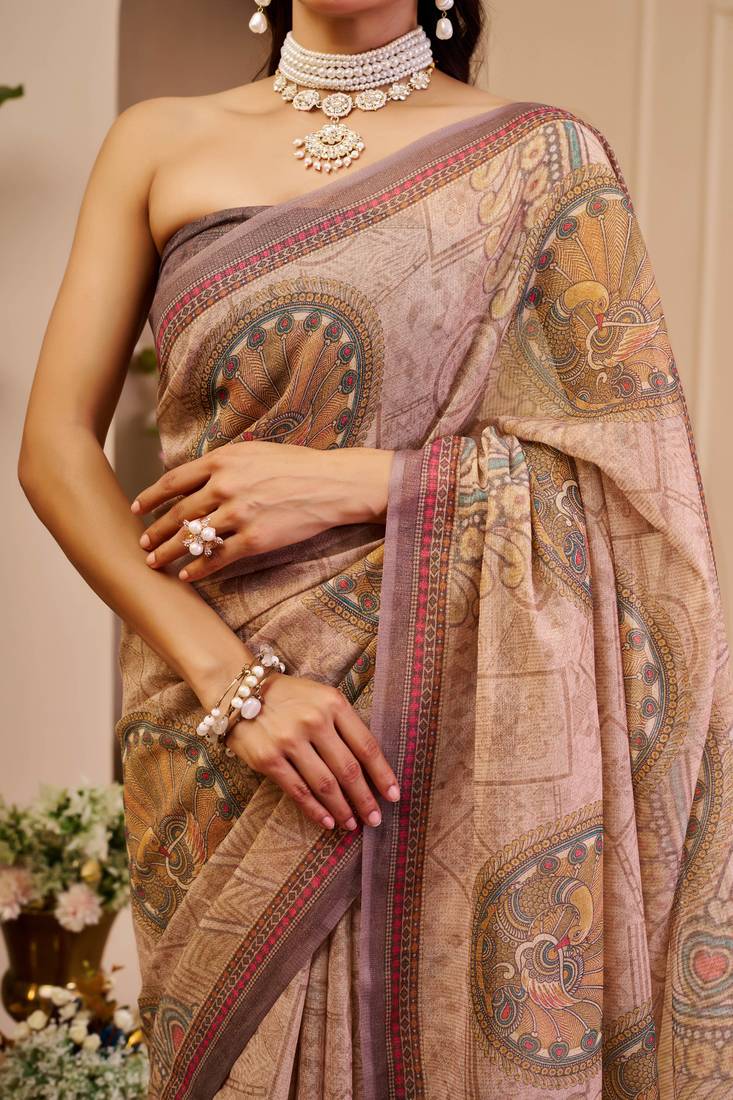Mauve shimmer printed zari saree with unstitched blouse piece.