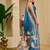 Blue shimmer printed zari saree with unstitched blouse piece.