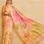 Peach shimmer printed zari saree with unstitched blouse piece.