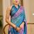 Blue shimmer printed zari saree with unstitched blouse piece.