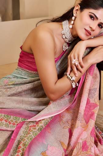 Pink shimmer printed zari saree with unstitched blouse piece.