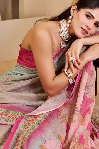 Pink shimmer printed zari saree with unstitched blouse piece.