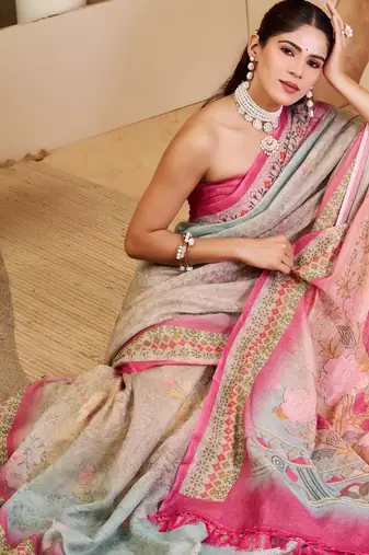 Pink shimmer printed zari saree with unstitched blouse piece.