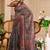 Grey shimmer printed zari saree with unstitched blouse piece.