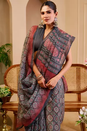 Grey shimmer printed zari saree with unstitched blouse piece.