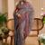Grey shimmer printed zari saree with unstitched blouse piece.