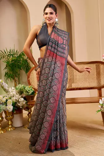 Grey shimmer printed zari saree with unstitched blouse piece.