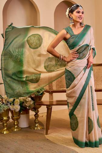 Beige shimmer printed zari saree with unstitched blouse piece.