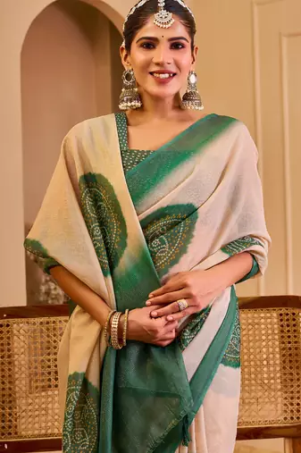 Beige shimmer printed zari saree with unstitched blouse piece.