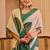 Beige shimmer printed zari saree with unstitched blouse piece.