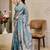 Turquoise shimmer printed zari saree with unstitched blouse piece.