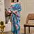Blue shimmer printed zari saree with unstitched blouse piece.