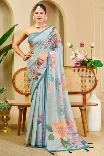 Sky blue shimmer printed zari saree with unstitched blouse piece.