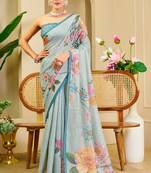 Sky blue shimmer printed zari saree with unstitched blouse piece.