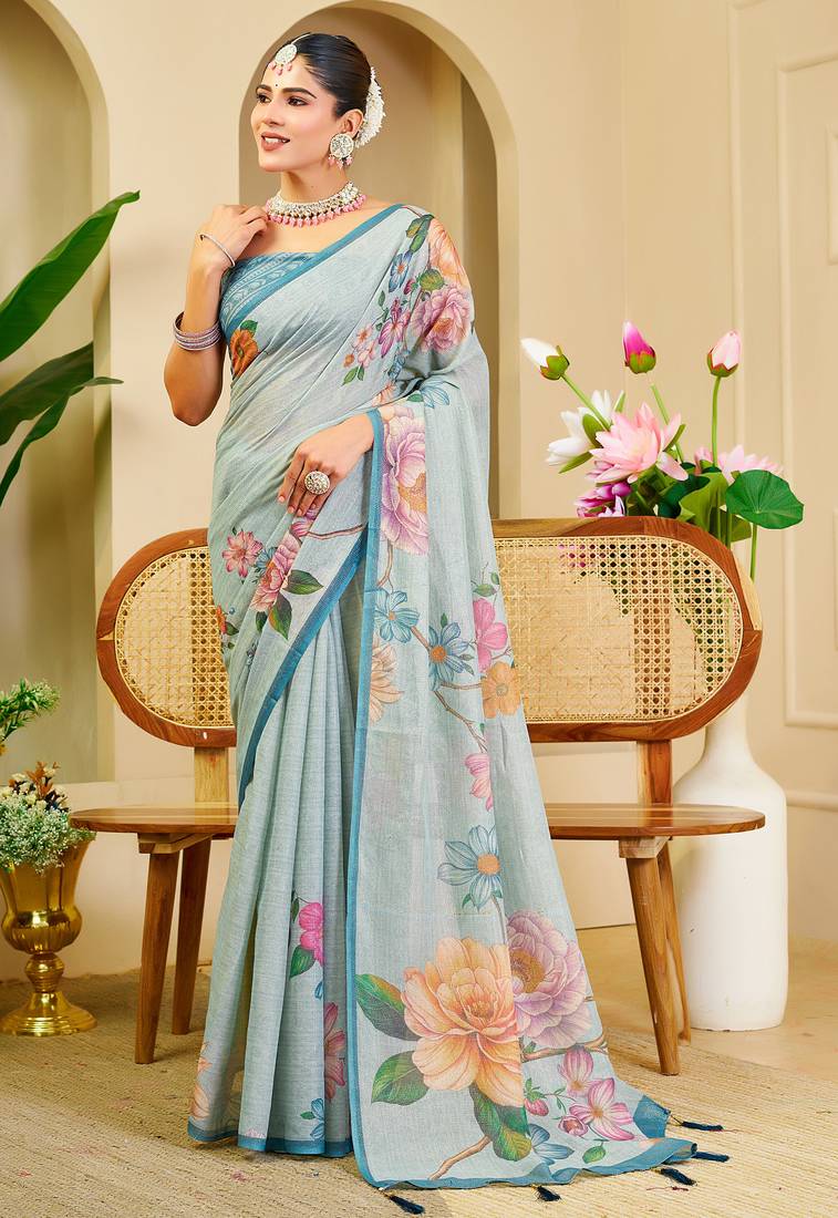Sky blue shimmer printed zari saree with unstitched blouse piece.