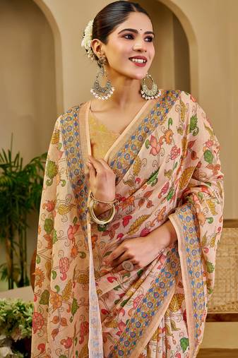 Peach shimmer printed zari saree with unstitched blouse piece.