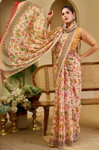 Peach shimmer printed zari saree with unstitched blouse piece.