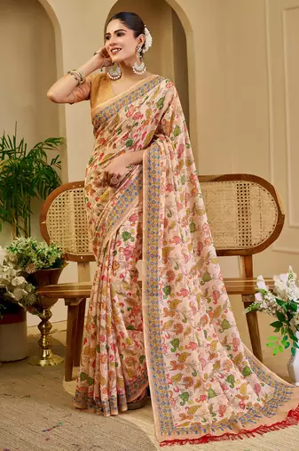 Peach shimmer printed zari saree with unstitched blouse piece.