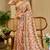 Peach shimmer printed zari saree with unstitched blouse piece.