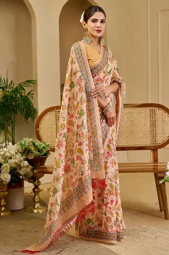 Peach shimmer printed zari saree with unstitched blouse piece.