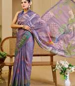 Purple shimmer printed zari saree with unstitched blouse piece.