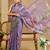 Purple shimmer printed zari saree with unstitched blouse piece.