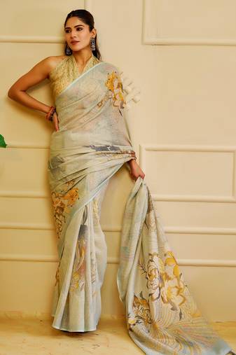 Sky blue shimmer printed zari saree with unstitched blouse piece.