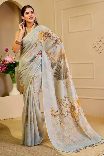 Sky blue shimmer printed zari saree with unstitched blouse piece.