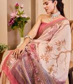 Peach shimmer printed zari saree with unstitched blouse piece.