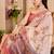 Peach shimmer printed zari saree with unstitched blouse piece.