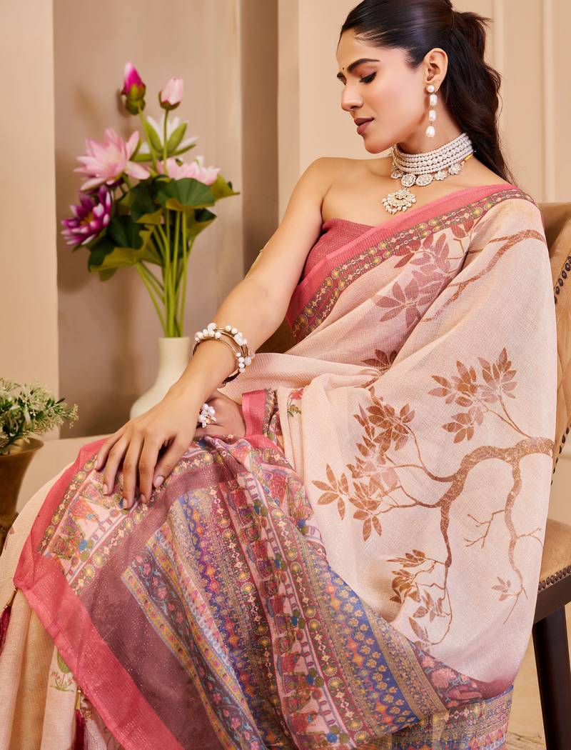 Peach shimmer printed zari saree with unstitched blouse piece.