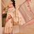 Peach shimmer printed zari saree with unstitched blouse piece.